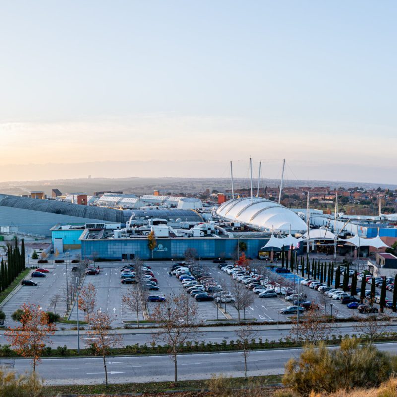 December 11, 2025. Arroyomolinos, Spain. Elevated exterior view of the Xanadu shopping and leisure center with parking areas, modern architecture and surrounding landscape